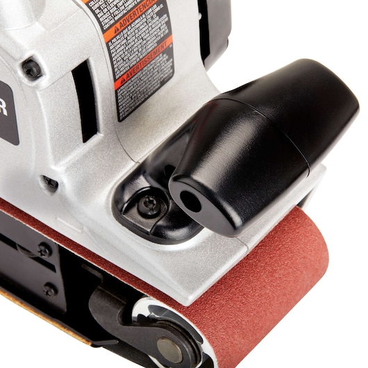 Close-up view of a PORTER-CABLE 352VS belt sander showing the sanding belt, dust extraction port, and part of the machine's metallic body.