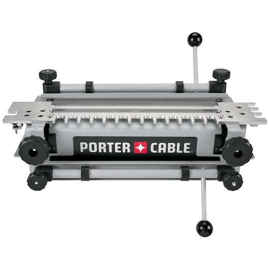 A PORTER-CABLE 4210 woodworking dovetail jig, featuring adjustable knobs and metal guides, used for creating dovetail joints in wood pieces.