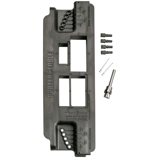 A PORTER-CABLE door lock installation kit including a black plastic template with labeled cutouts for latch and lockset holes, several drill bits, alignment pins, and accessories arranged alongside the template.