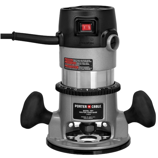 A PORTER-CABLE Model 1001 fixed base router with black handles, a black top with power switch, and a metallic body. The base is round, and there are warning labels visible on the front.