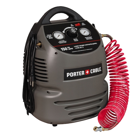 A portable PORTER-CABLE air compressor with a coiled red hose attached. The compressor is grey with black control panel featuring two pressure gauges and a handle on top. Power cord is wrapped on the side.