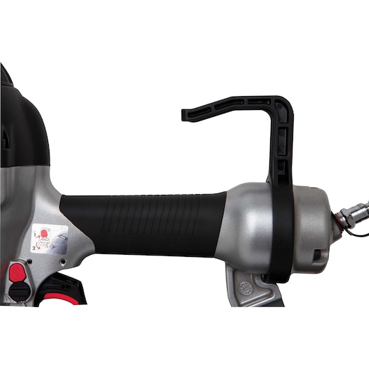 Close-up view of a PORTER-CABLE pneumatic nail gun, showing the handle, trigger, and air hose connection.