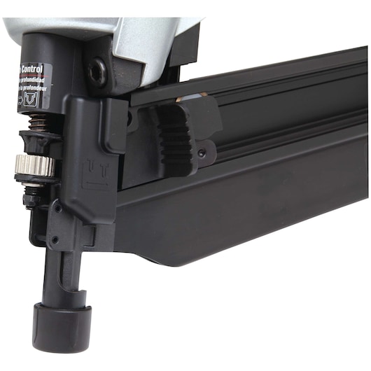Close-up image of the lower portion of a PORTER-CABLE nail gun, showing the adjustment mechanism and nail magazine.