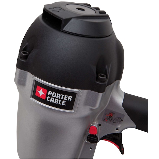 Close-up view of the PORTER-CABLE FR350B pneumatic nail gun, showing the brand logo and part of the trigger mechanism.