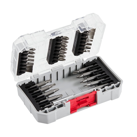 A set of metal screwdriver bits organized in a gray and clear plastic storage case with a red latch. The bits are arranged in foam slots inside the case and on the inner side of the lid.