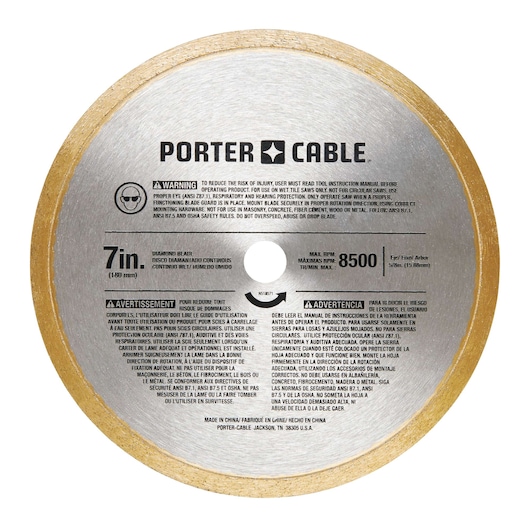 A PORTER-CABLE 7-inch diamond blade for wet cutting, featuring safety warnings and usage instructions printed in English, French, and Spanish on the blade. The blade has a maximum RPM of 8500 and a gold edge around the circumference.