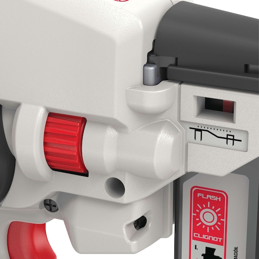 Close-up of a PORTER-CABLE photography tool showing detailed controls, including a red adjustment knob, a labeled indicator, and a flash symbol with instructions.