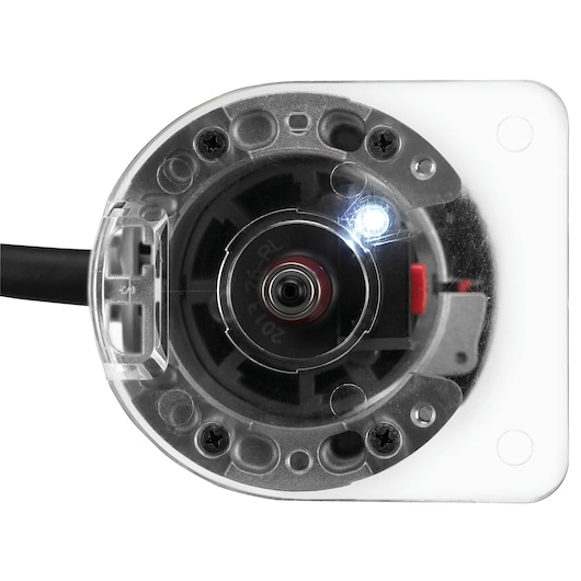 Close-up view of the base of a PORTER-CABLE PCE6430 power tool, showing the transparent plastic base, metal parts, screws, and LED light.