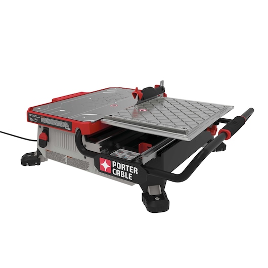 A PORTER-CABLE branded tile cutting machine with a designed metal table, sliding tray, and visible power cord. The machine is mainly red, gray, and black in color and is intended for precision tile cutting.