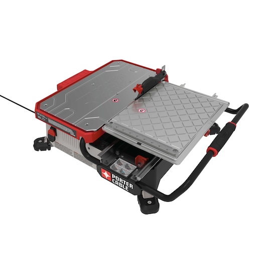 A PORTER-CABLE branded tile saw with a sliding table and metal surface, featuring red and black accents, designed for precise cutting tasks.