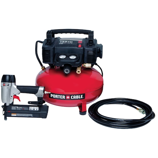 A red PORTER-CABLE air compressor with attached gauges, a pneumatic nail gun, and a coiled black air hose placed next to it.