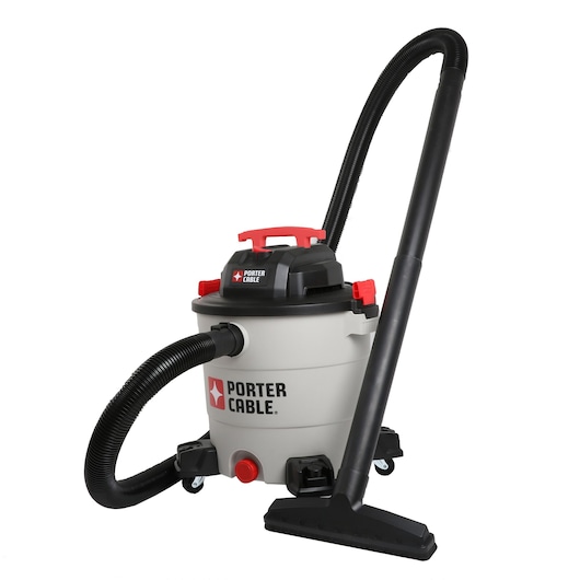 A PORTER-CABLE wet/dry vacuum with a large cylindrical body, black hose, and attachments. The vacuum has a white and black design with red accents and wheels at the base.