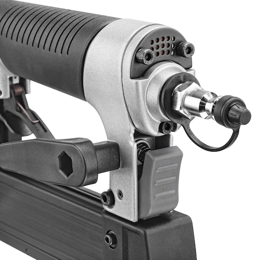 Close-up view of a PORTER-CABLE pneumatic nail gun showing its trigger and air hose connector.